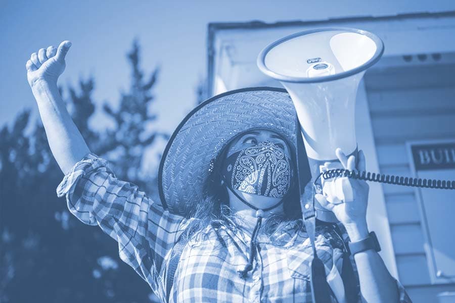 A placeholder image of a person holding their hand up and holding a megaphone