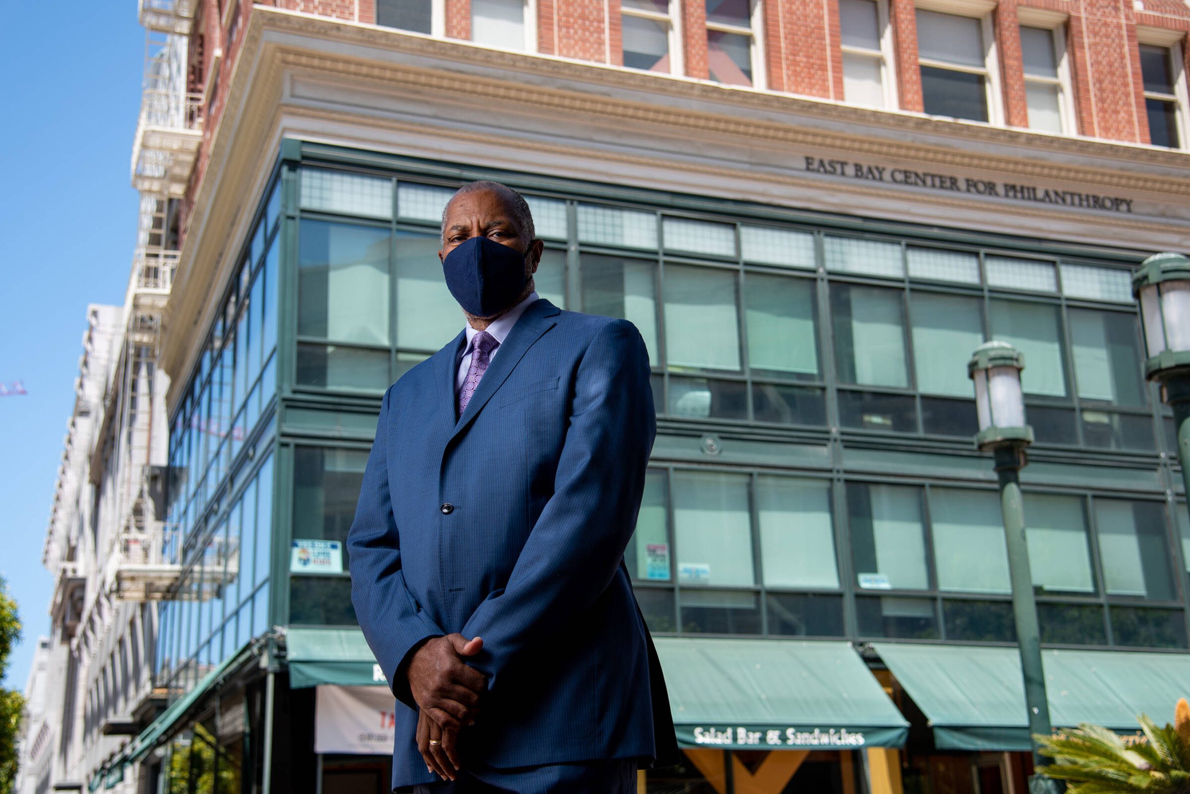 James W. Head standing in front of the East Bay Community Foundation building