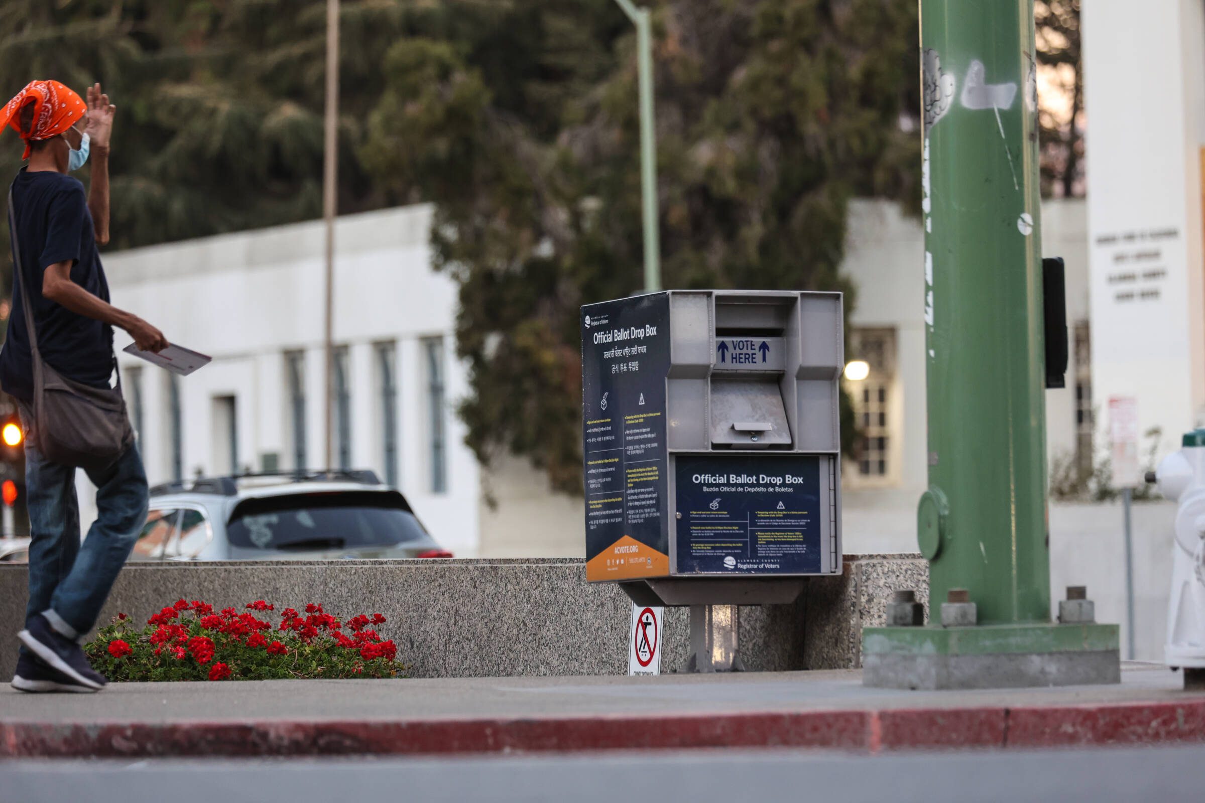 Woman dropping off her ballot