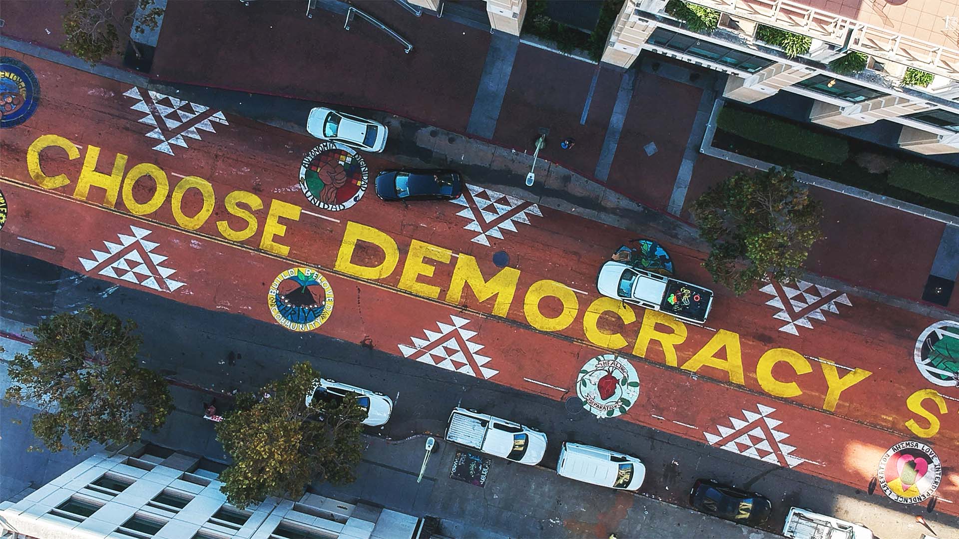 Overhead shot of a street with "Choose Democracy" written on it