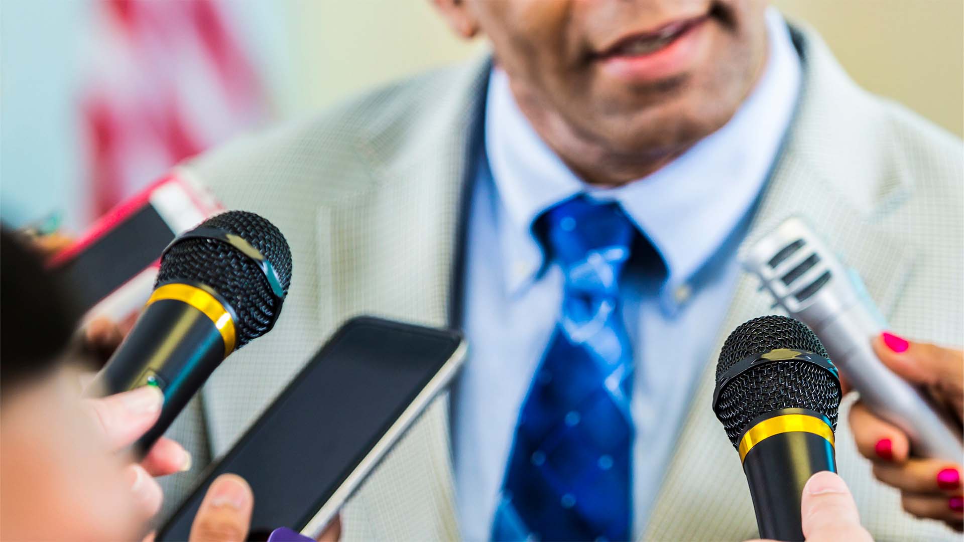 Reporters holding microphones