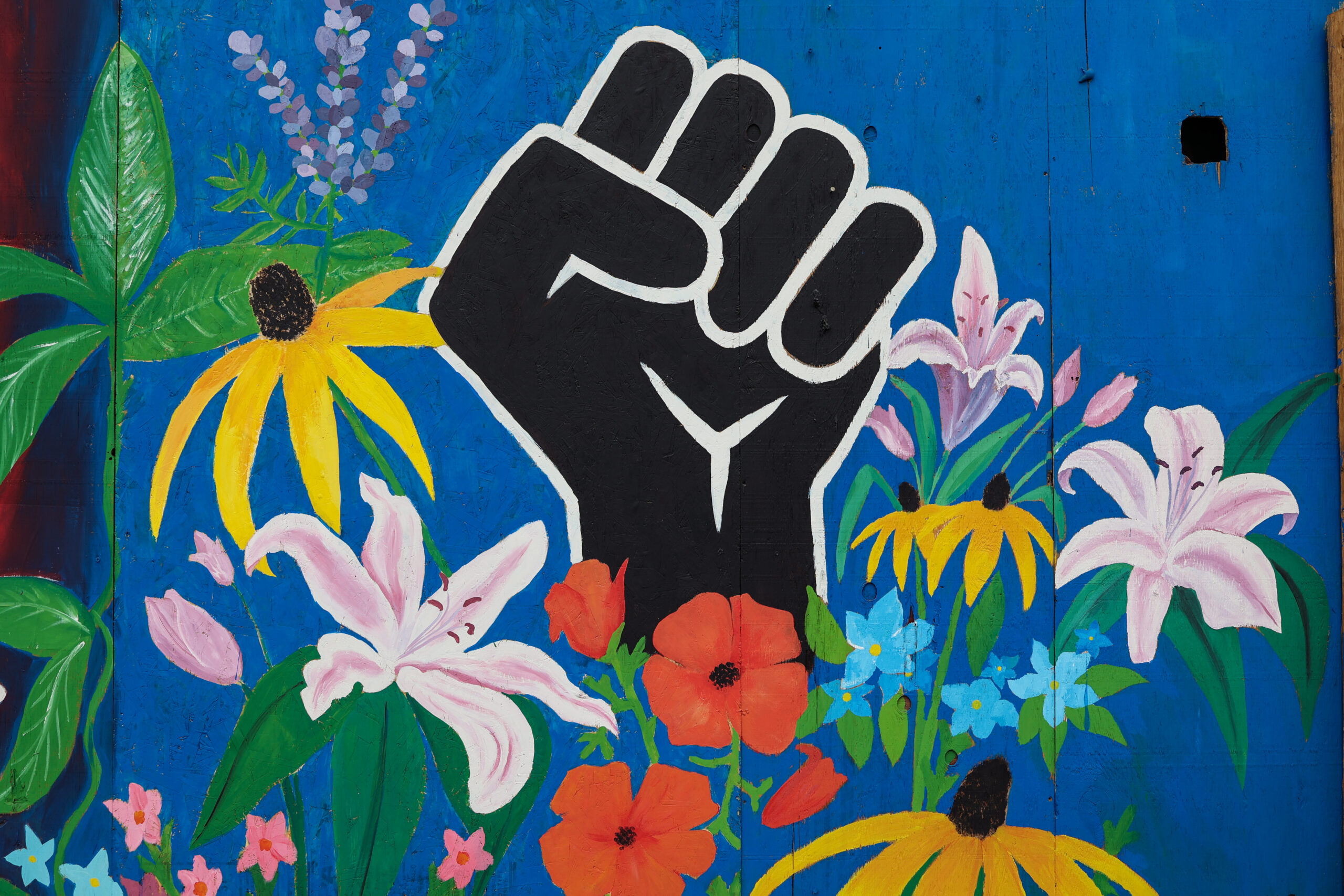 Mural of a black fist and flowers